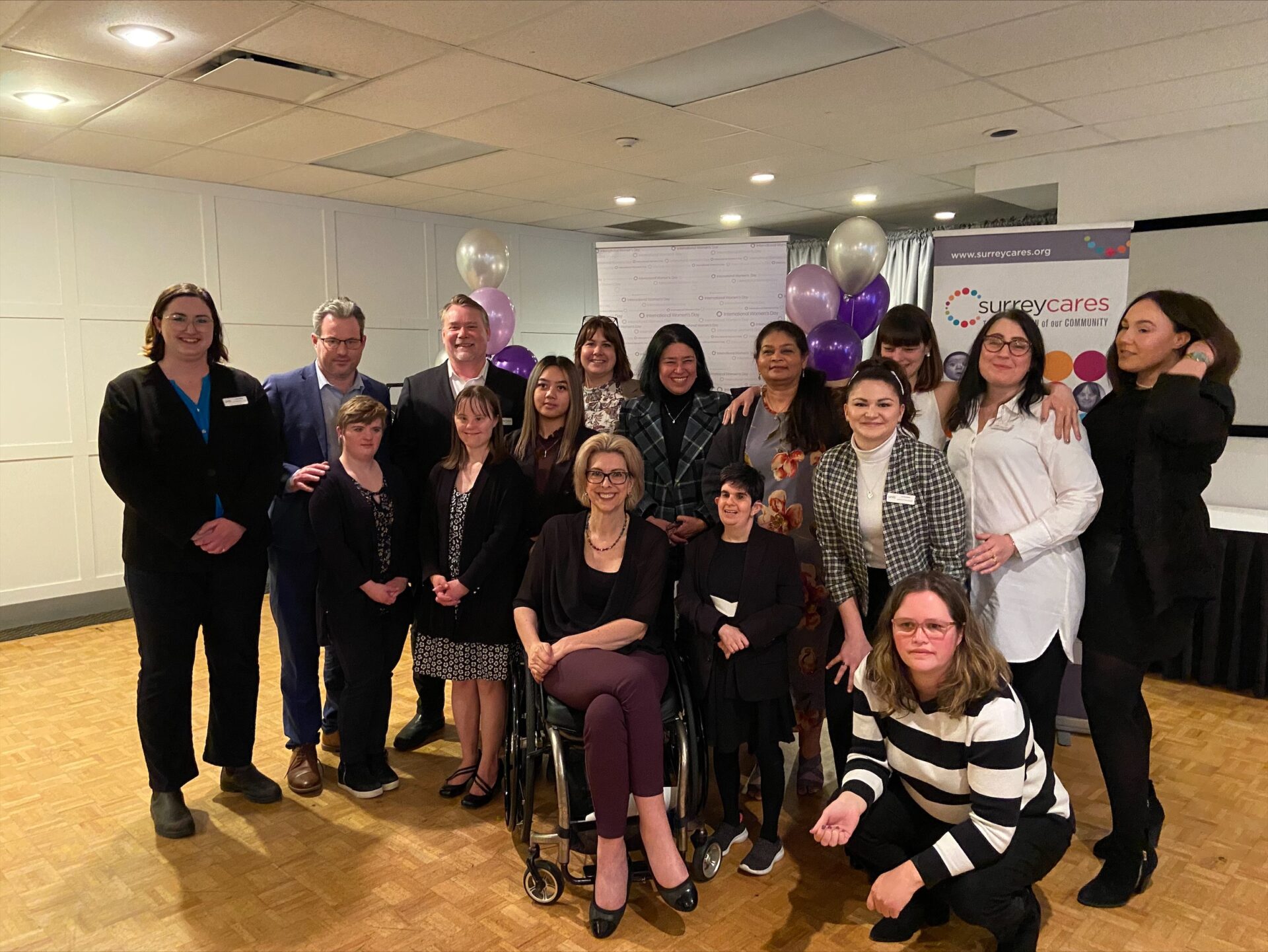 UNITI CEO, Directors, Staff and Self-Advocates pose for a photo with Stephanie Cadieux, then MLA and now Canada's Chief Accessibility Officer at the International Women's Day luncheon.