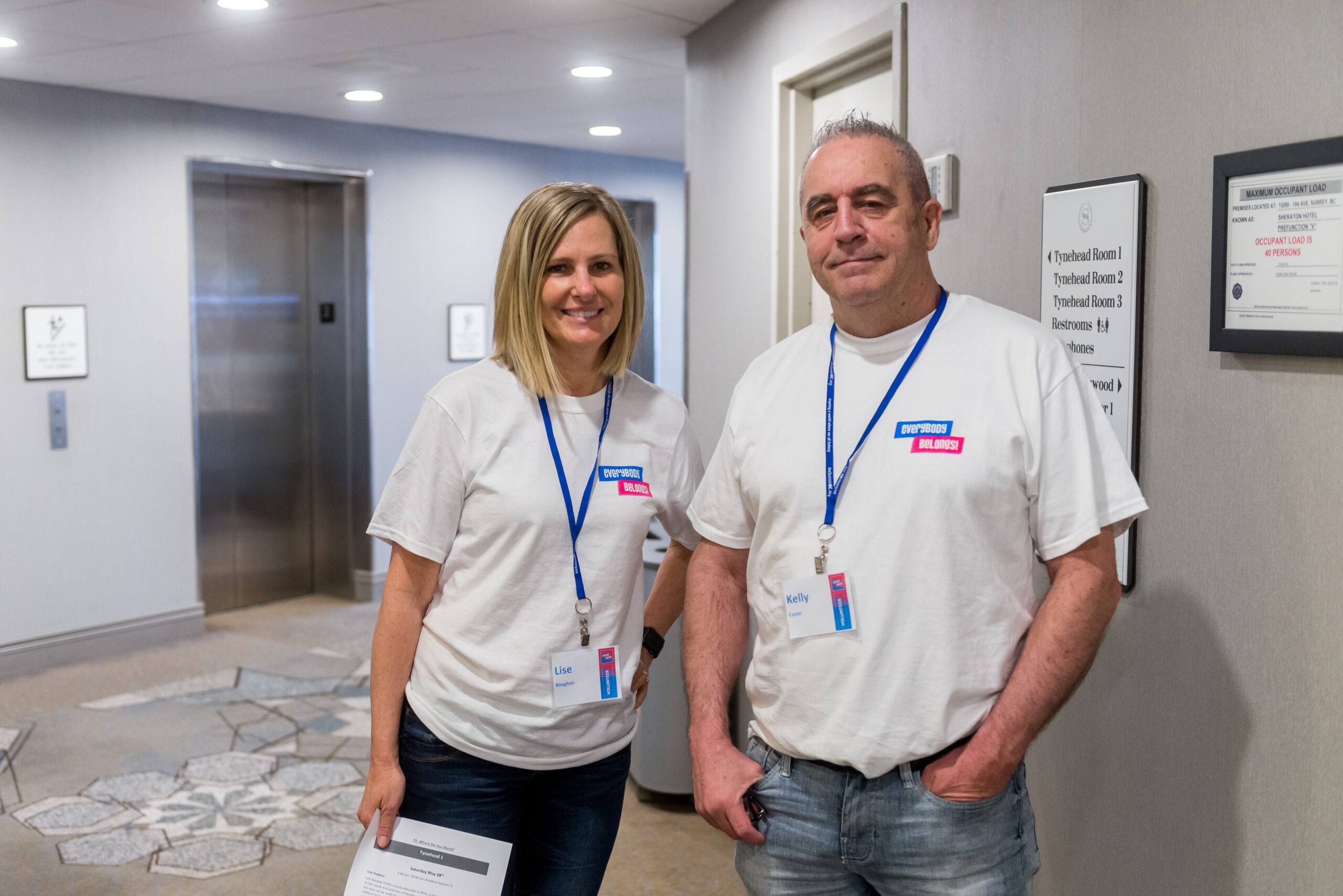 UNITI director, Lise Boughen, stands beside UNITI community member and Inclusion BC volunteer at the Everybody Belongs! Conference in May 2022.