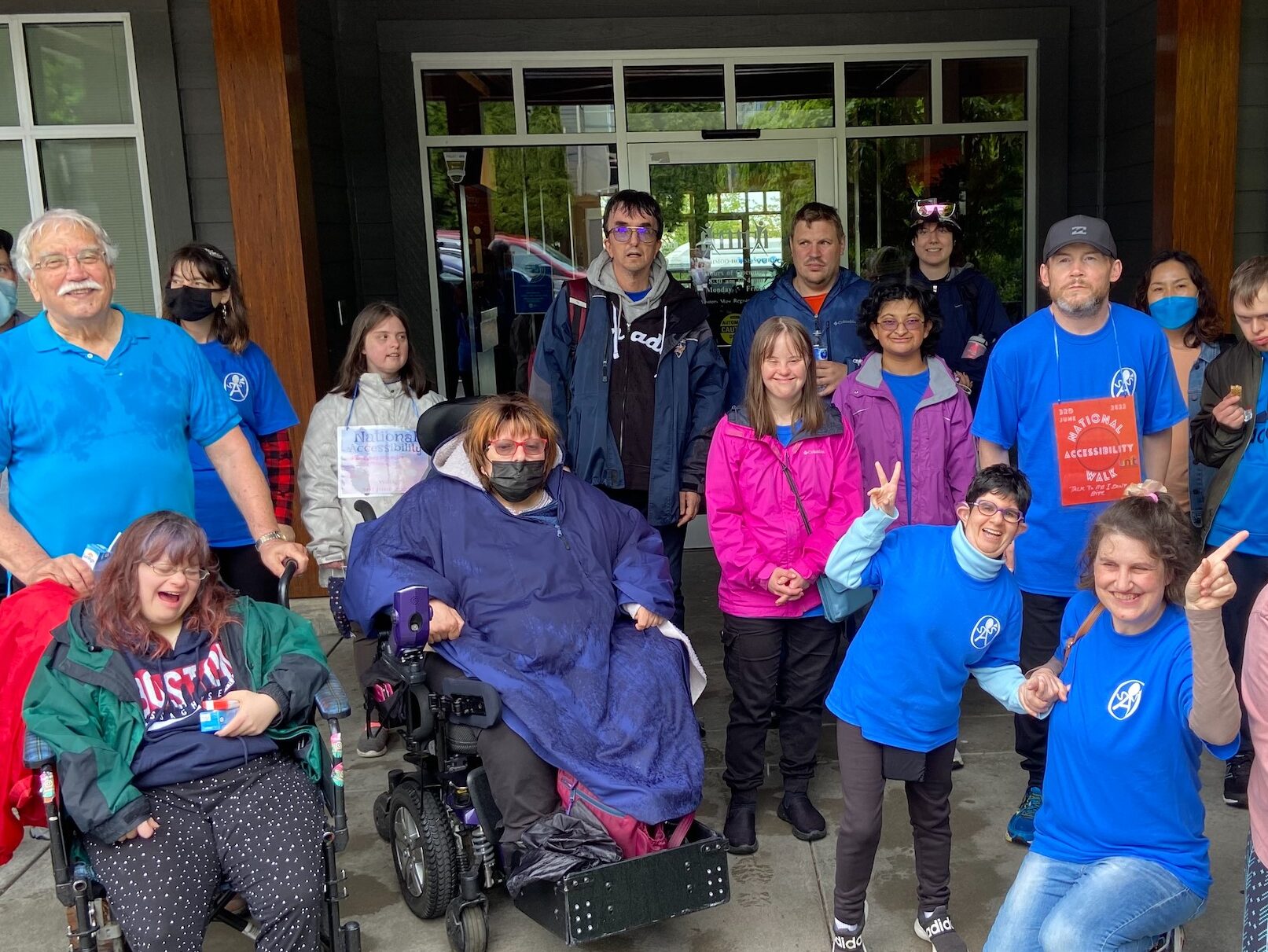 Self Advocates and UNITI community members posing for a group photo outside of UNITI South Campus after the Accessibility Walk in June 2022.