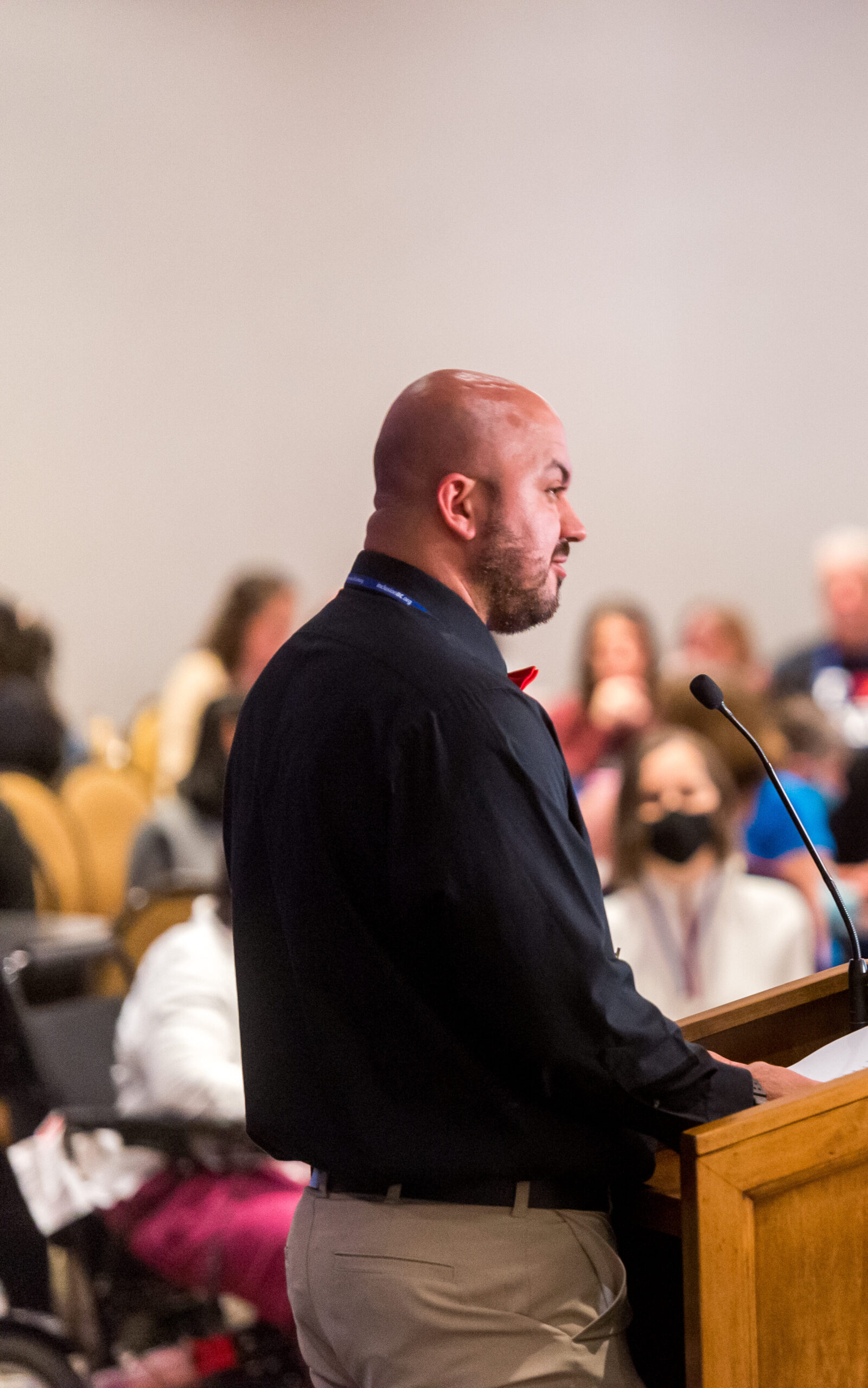 Board Member Alex Magnusson presents to the crowd at the Inclusion BC conference 2022.